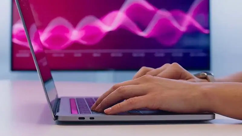 Person researching businesses on a laptop with AI search